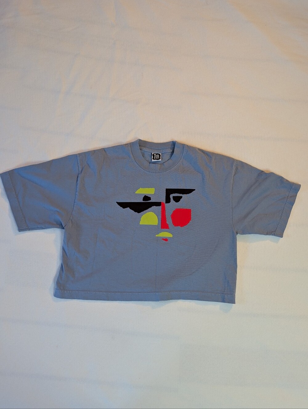 Tokens Label Peek-A-Boo Abstract Face Blue Crop Top